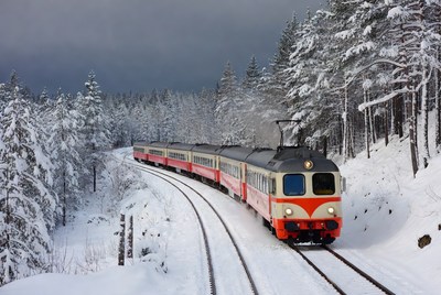 Winter train journey through snowy landscape