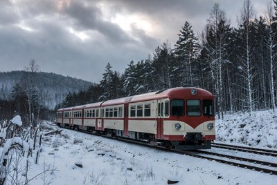 Snowy train journey through forest