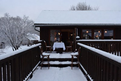 Cozy winter dining by the snow