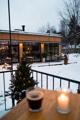 Cozy winter cafe scene at dusk