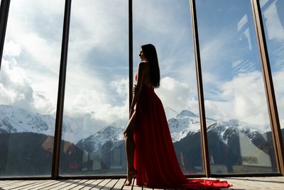 Woman in red dress with mountain view