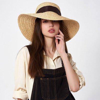 Woman wearing wide-brimmed straw hat