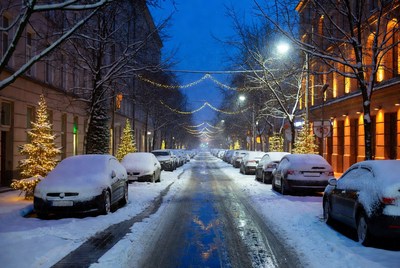 Quiet snowy street at dusk
