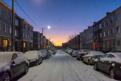 Winter evening in a snowy neighborhood