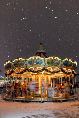Enchanting carousel in snowy night