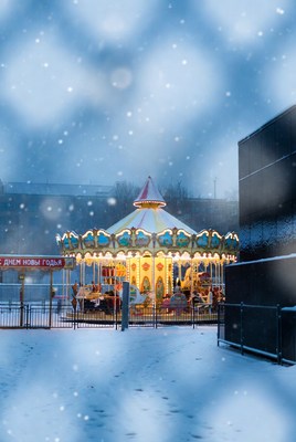 Winter carousel in snowy park