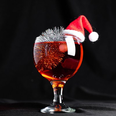 Festive cocktail with holiday hat