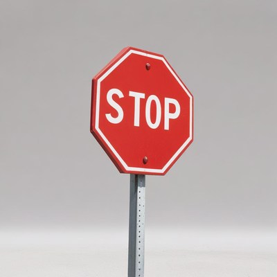 Clear stop sign on gray background