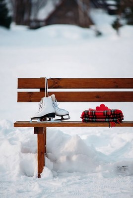Ice skates and blanket in winter