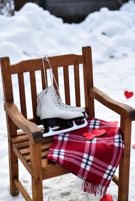 Ice skates on chair in winter
