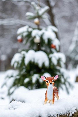 Snowy scene with a toy deer