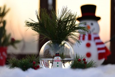 Winter decor with snowman and greenery