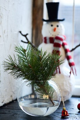 Festive decor with snowman and greenery