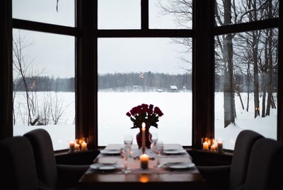 Cozy winter dinner with snowy view