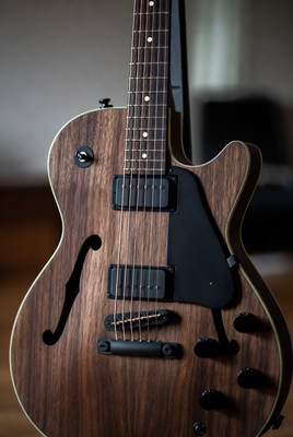 Close-up of stylish wooden guitar