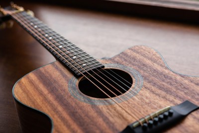Acoustic guitar on wooden table