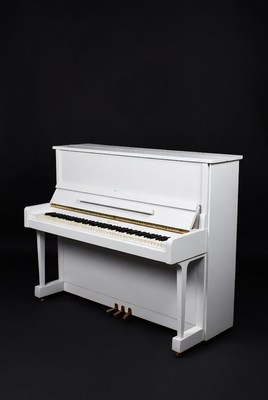 Elegant white upright piano against dark backdrop