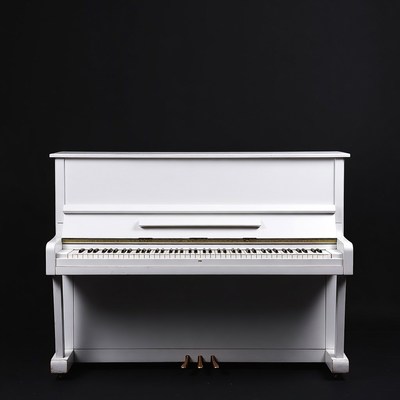 Elegant white piano against a black backdrop