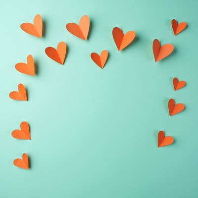 Colorful hearts on turquoise wall
