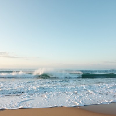Waves crashing on sandy shore