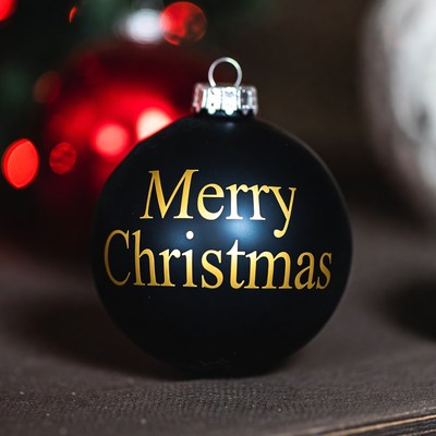 Black christmas ornament with gold letters