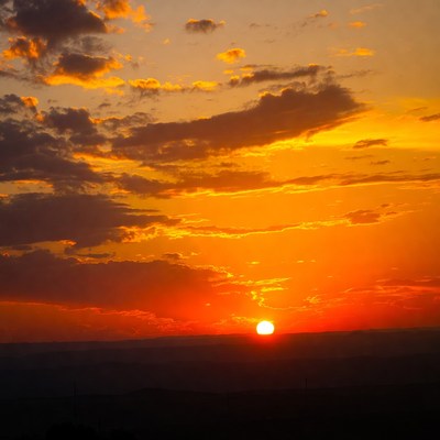Sunset over the horizon with clouds