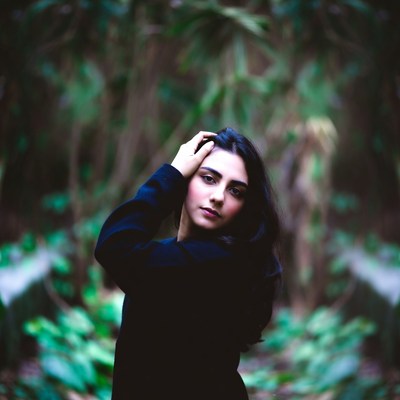Woman posing in a forest setting