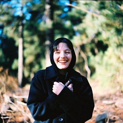 Smiling girl in the forest