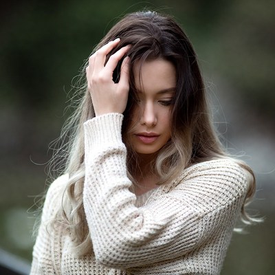 Woman touching her hair outdoors