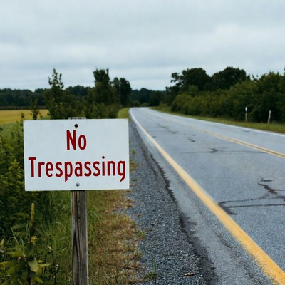 Sign for no trespassing on road