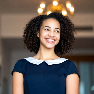 Smiling girl in a blue dress