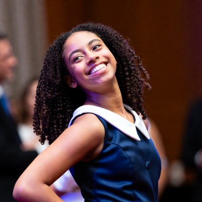 Young girl smiling at event