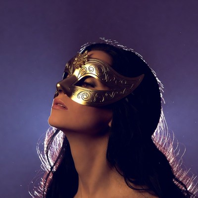 Woman in golden mask poses