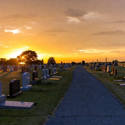 Sunset over cemetery pathway
