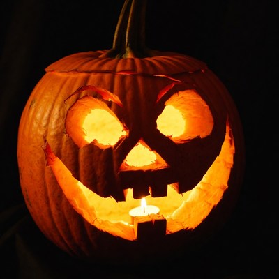 Carved pumpkin with candle light