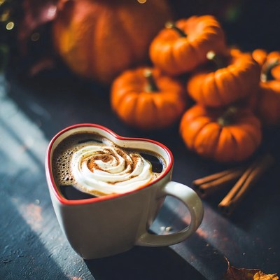 Heart-shaped coffee with pumpkins