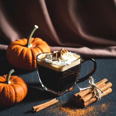 Coffee with cinnamon and pumpkins in autumn