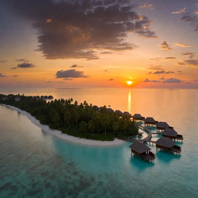 Sunset over water villas in maldives
