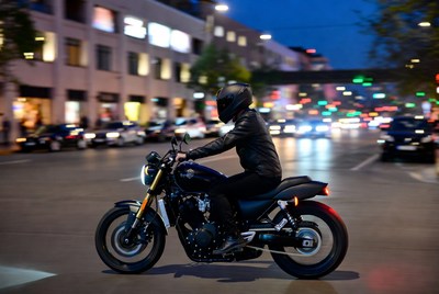 Rider on motorcycle at night