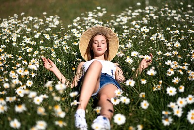 Lying in a field of flowers