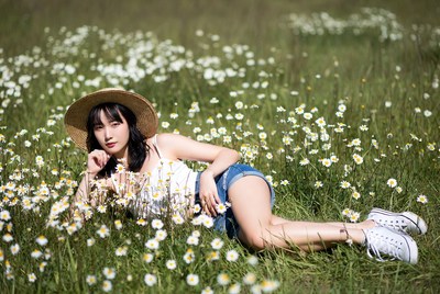 Woman relaxing in a flower field