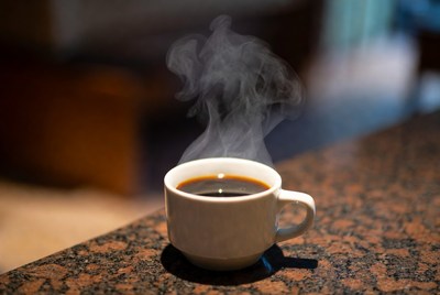Warm cup of coffee on a table