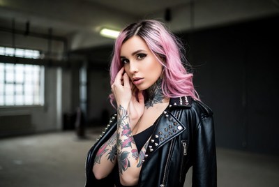 Woman with pink hair in spiked jacket
