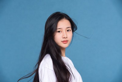 Young woman with long hair poses