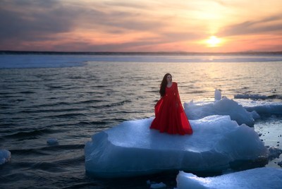 Woman on ice at sunset