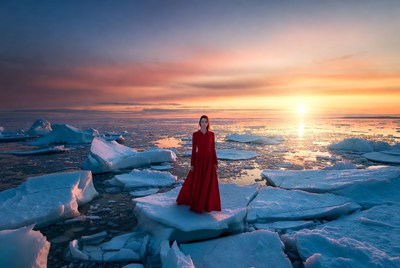 Woman in red dress at sunset