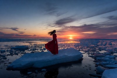 Woman in red dress on ice