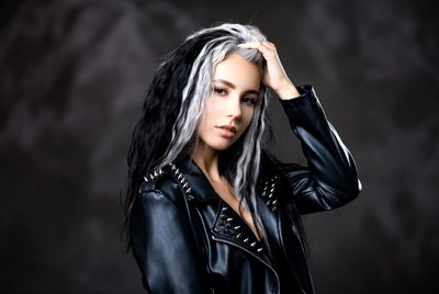 Woman with black and white hair poses