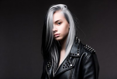 Young woman with silver hair and leather jacket