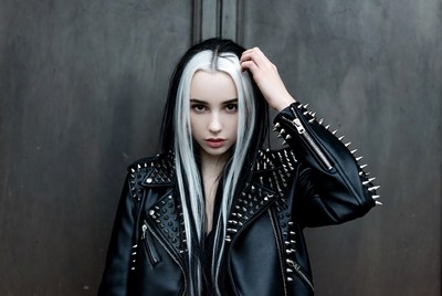 Young person in spiked leather jacket